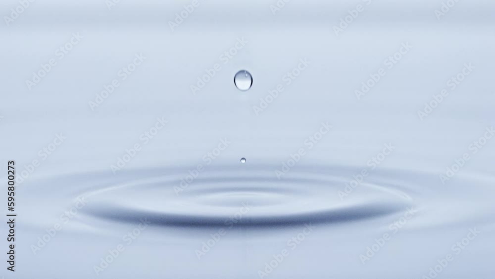 Water drop falling down in slow motion.
Water drop falling down in slow motion.