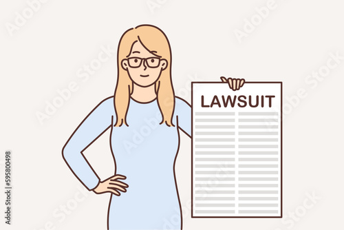 Woman shows poster with lawsuit related to patent infringement or broken business contract deadlines