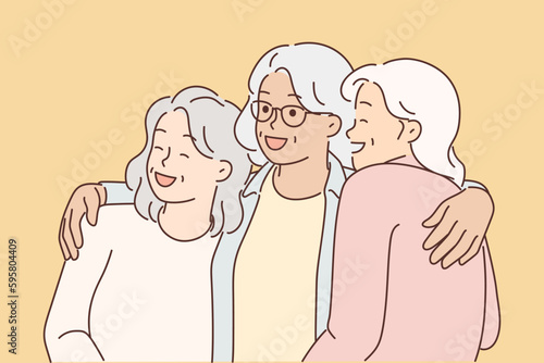Three elderly women laugh and hug for first time having met after long separation