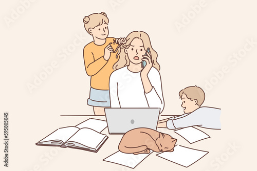 Mother works as freelancer at home and sits with children suffering from lack of workspace
