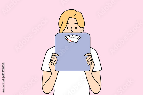 Woman holding scales in hands worried about body weight and figure. Female with weighing scales anxious about diet and weightloss. Vector illustration. 