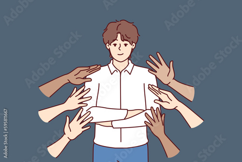 Popular business man beside many hands wanting to touch idol, for concept of corporate training or team building activities. Proud guy in business clothes are popular among colleagues 