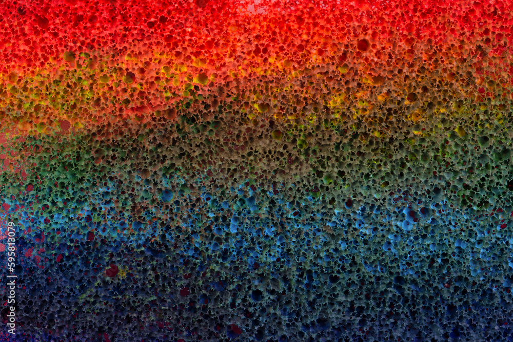 Sponge in multi-colored paint, abstract background, backdrop. Sponge in multi-colored paint, abstract background, backdrop.