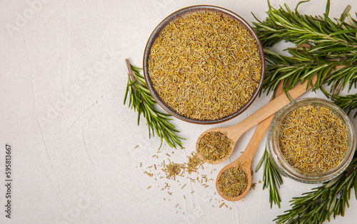 Dried rosemary and branches of fresh rosemary on a white texture background. Spicy spices. Seasoning for meat and fish. Cooking concept. RECEPT. Close-up. place for text. photo