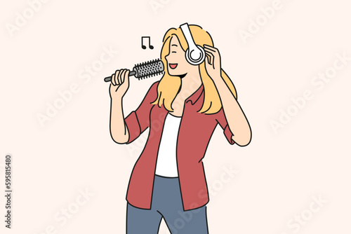 Smiling woman in headphones sing in hairbrush. Happy girl have fun enjoy singing with brush in hands. Hobby and entertainment. Vector illustration. 