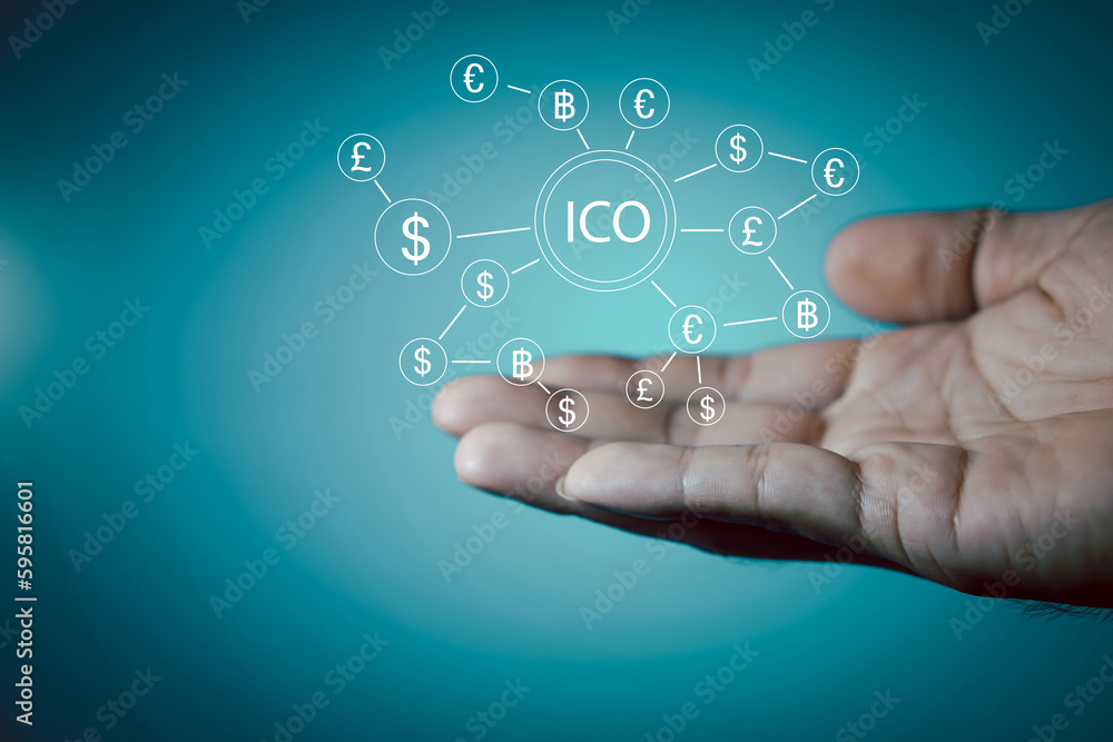 ICO ,Businessman presses button ICO Initial Coin Offering in network shield security virus user interface. ICO ,Businessman presses button ICO Initial Coin Offering in network shield security virus user interface.