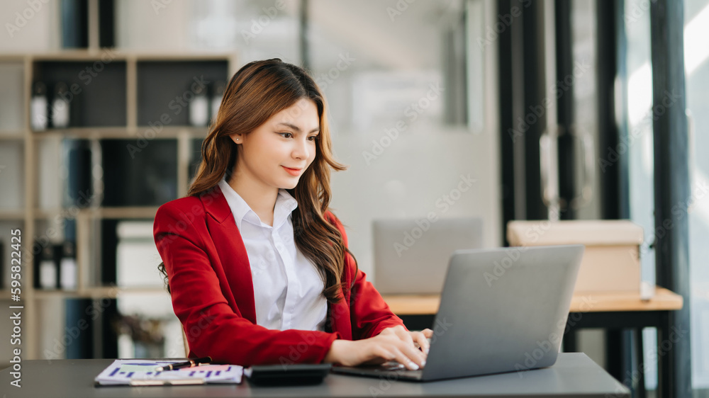 Woman freelancer is working her job on computer tablet and laptop Doing accounting analysis report real estate investment data, Financial at office. Woman freelancer is working her job on computer tablet and laptop Doing accounting analysis report real estate investment data, Financial at office.