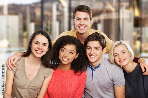 Happy group of young university students.