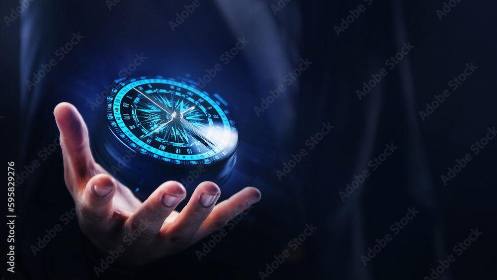 Concept of Strategic orientation in business or marketing. Purpose and direction in business. Compass in the hands of a businessman - obrazy, fototapety, plakaty 