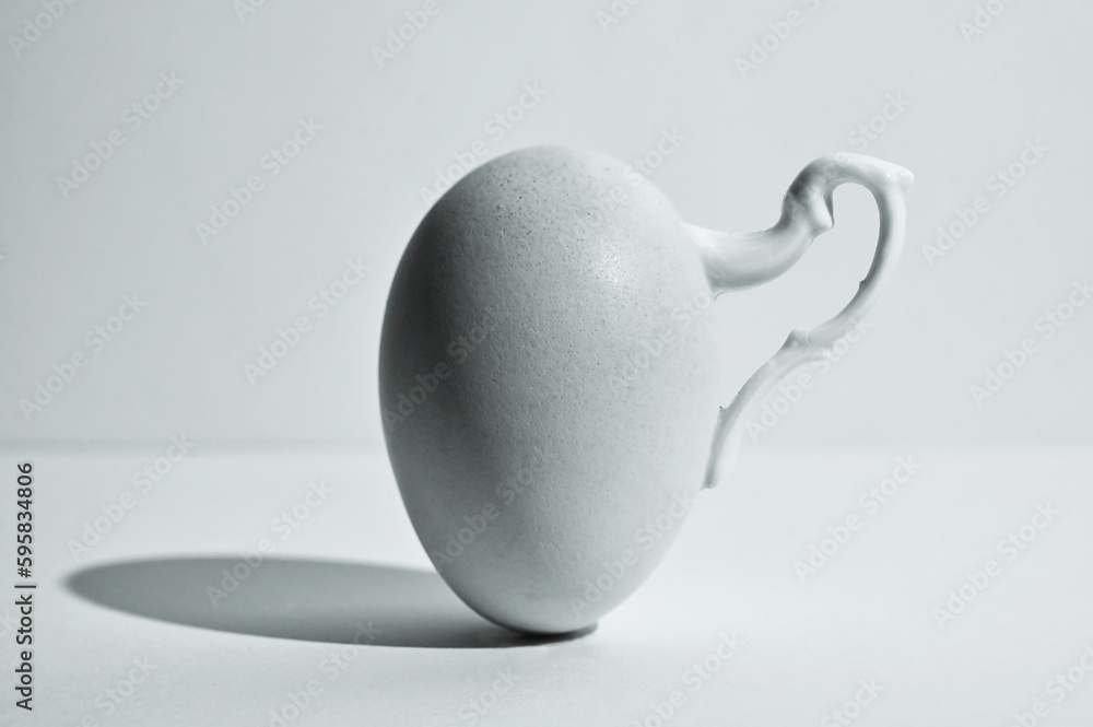 Egg and Shadow With Handle Of A Cup
