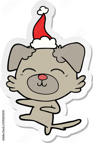 hand drawn sticker cartoon of a dog kicking wearing santa hat