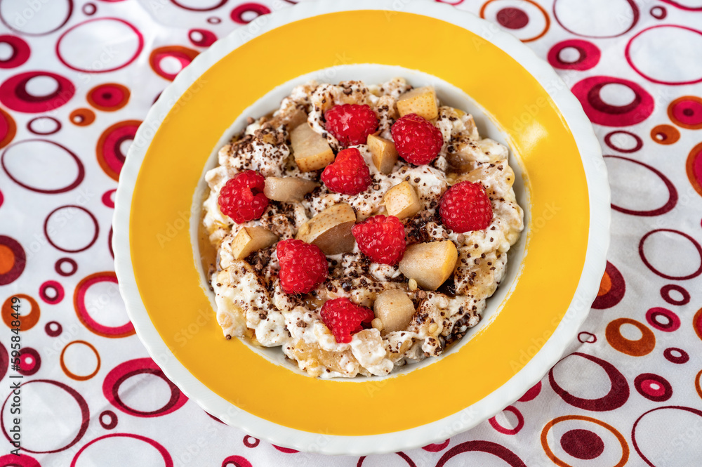 Oatmeal porridge, yogurt,raspberry, pear and cocoa and honey. Oatmeal porridge, yogurt,raspberry, pear and cocoa and honey.