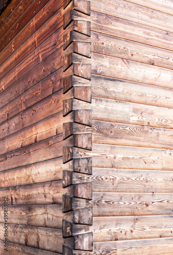 Obraz na płótnie the corner of a wooden house with dovetail joints w salonie
