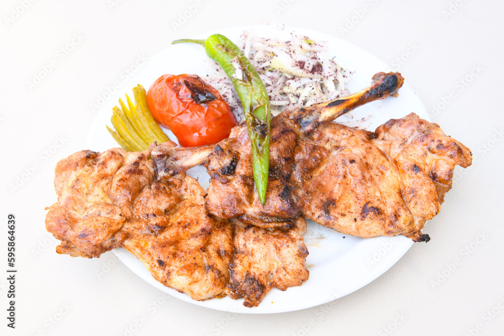 Chicken wings barbeque in a dish with BBQ grill sauce . Izgara tavuk kelebek sis kanat. Tavuk sis, gogus.