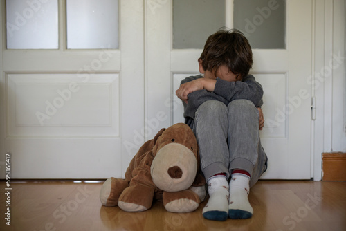 view of a child victim of child abuse photo