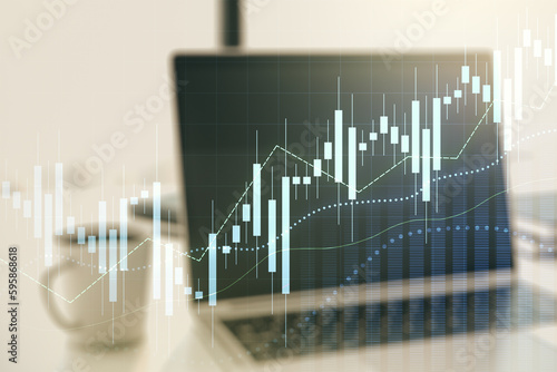Abstract creative financial graph on modern laptop background, forex and investment concept. Multiexposure © Pixels Hunter