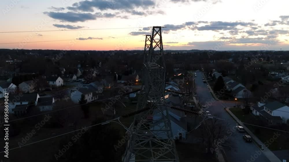 High voltage power lines, electricity distribution grid. Homes nearby