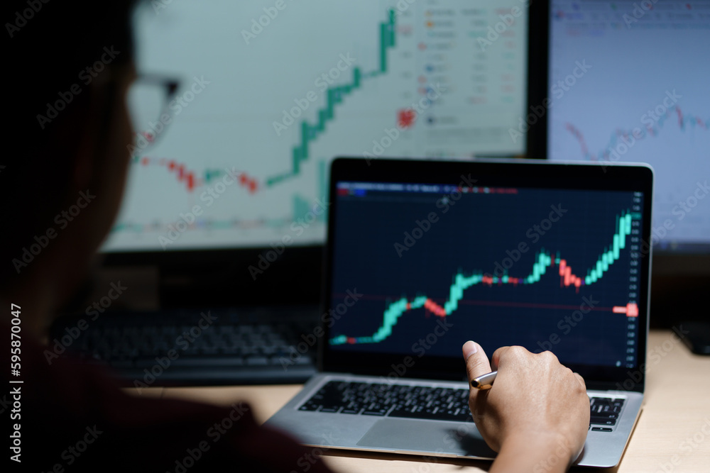 trader working in modern office, looking at display, sale and buy and analyzing index on market diagram. trader working in modern office, looking at display, sale and buy and analyzing index on market diagram.