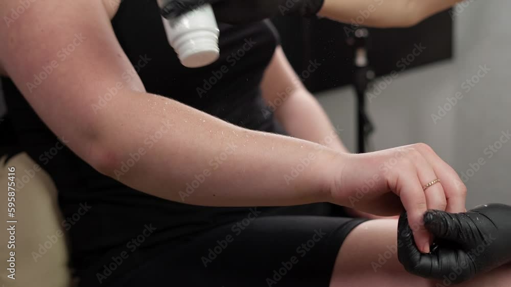 Beautician uses professional cosmetics for Depilation. Preparation for Hair Depilation. Close-up Beautician uses professional cosmetics for Depilation. Preparation for Hair Depilation. Close-up