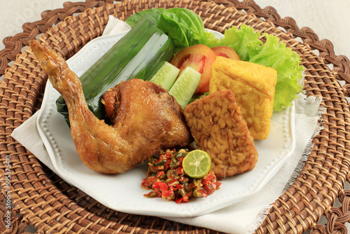Nasi Timbel Komplit, Traditional Sundanese Rice Wrapped photo