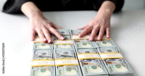 Businesswoman or judge offers one million dollar bribe. Large monetary financial bribe photo