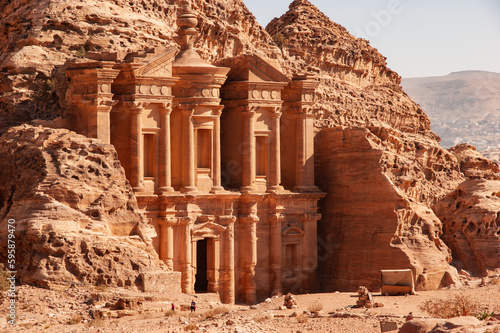 Facade of Ad-Deir Monastery in Petra Jordan. Monastery carved into sandy rocks is one of most famous sights of Petra. Facade of Ad-Deira resembles Treasury