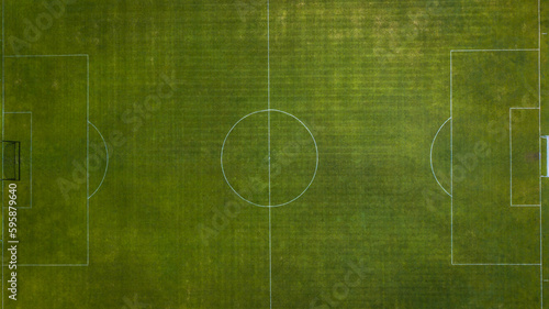 Aerial view of green football, soccer pitch. Top down view on a green, empty soccer field