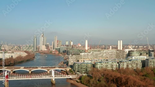 Rising aerial shot over Battersea Power station by the river thames photo