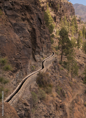 Gran Canaria, landscape of the southern part of the island along Barranco de Arguineguín steep and deep ravine with vertical rock walls, circular hiking route starting at a hamlet Barranquillo Andres