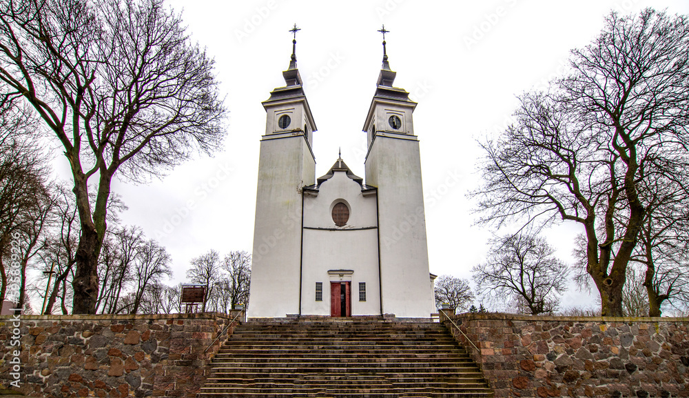 Fototapeta premium General view and architectural details of the baroque Roman Catholic church of St. Agnes built in 1924 in Goniadz, Podlasie, Poland.