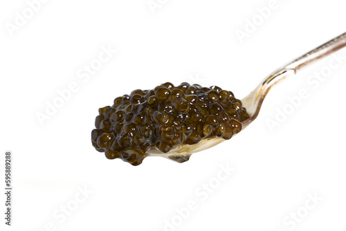A spoon with black caviar  isolated on white