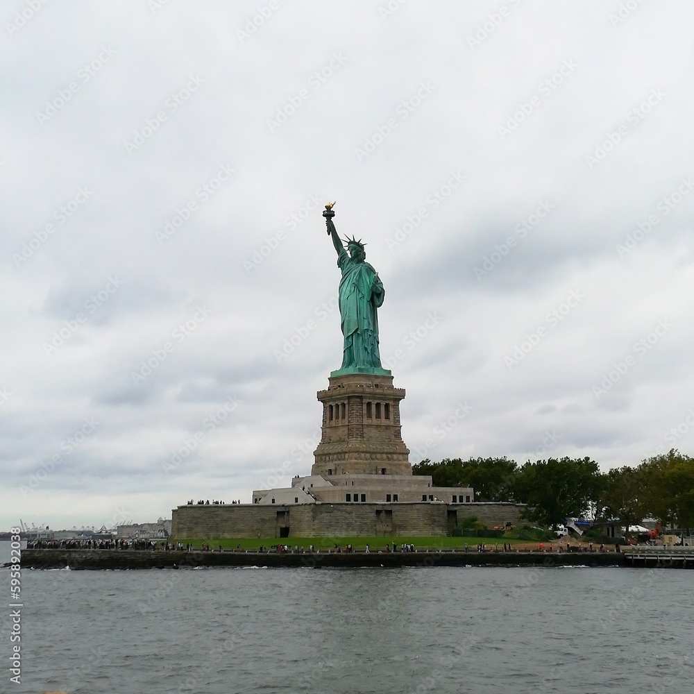 Panorama of the Statue of Liberty in autumn entourage, NYC