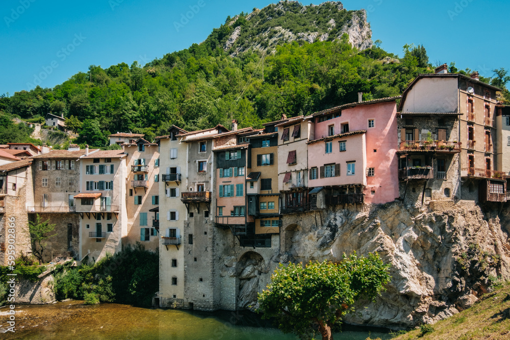 The Pont-en-Royans village with its hanging houses and the blue waters of the Bourne river in the Vercors, mountains of the French Alps