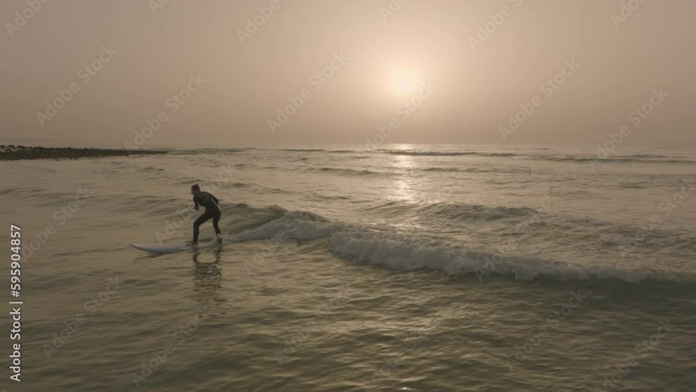 apple prores 422 surfer girl paddling wave and takeoff surfing wave on fuerteventura canary island with sunset apple prores 422 surfer girl paddling wave and takeoff surfing wave on fuerteventura canary island with sunset