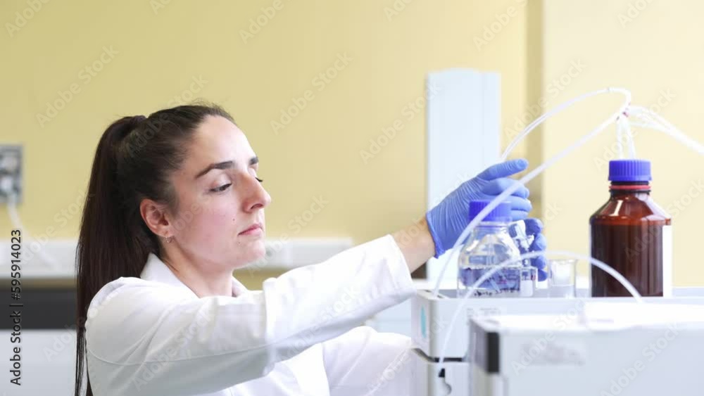 Young scientist or medical technician developing research new pharmacy medicine in glass flask in a clinical laboratory, concept of pharmaceutical studies and researches Young scientist or medical technician developing research new pharmacy medicine in glass flask in a clinical laboratory, concept of pharmaceutical studies and researches