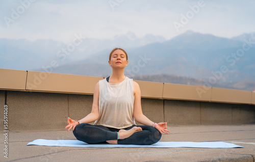 sportswoman is doing yoga