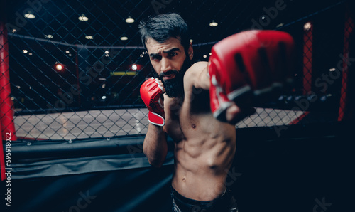 Foto MMA Fighter Preparing red gloves for training before sparring
