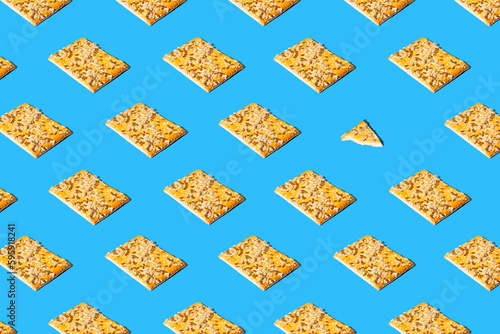 Creative pattern made of crunchy cereal cookies closeup on bright blue background. Healthy dessert concept. photo