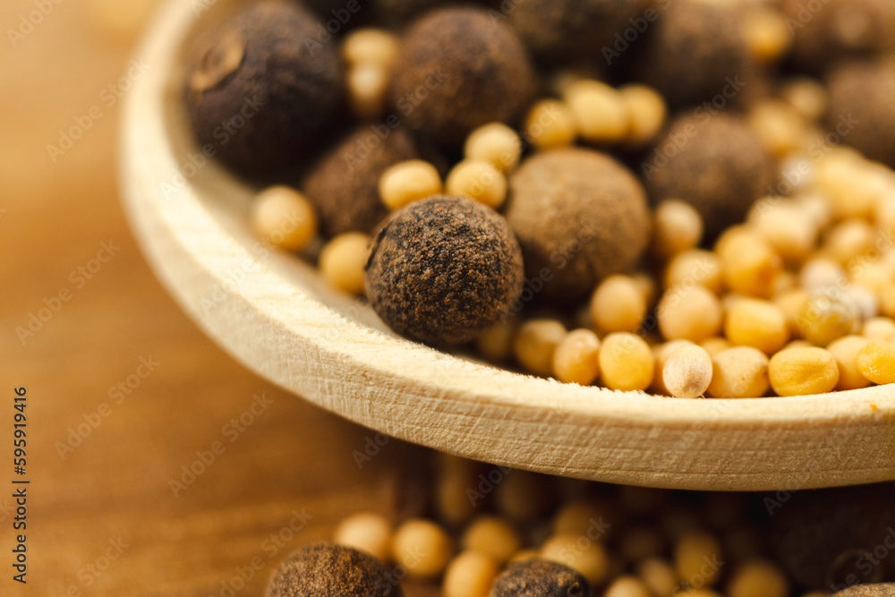 Black pepper with mustard seeds, close-up, macro. Selective focus Black pepper with mustard seeds, close-up, macro. Selective focus