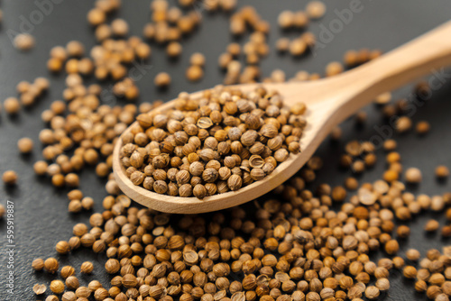 Coriander seeds, close-up, Chinese parsley, dhania and cilantro, used as aromatic and flavorful spice. photo