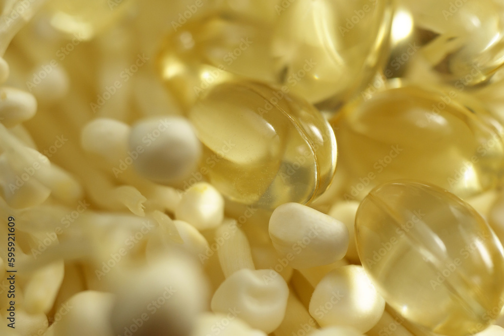 Mushroom or enoki close up macro, enokitake Flammulina velutipes. Capsules, dietary supplements. Mushroom or enoki close up macro, enokitake Flammulina velutipes. Capsules, dietary supplements.
