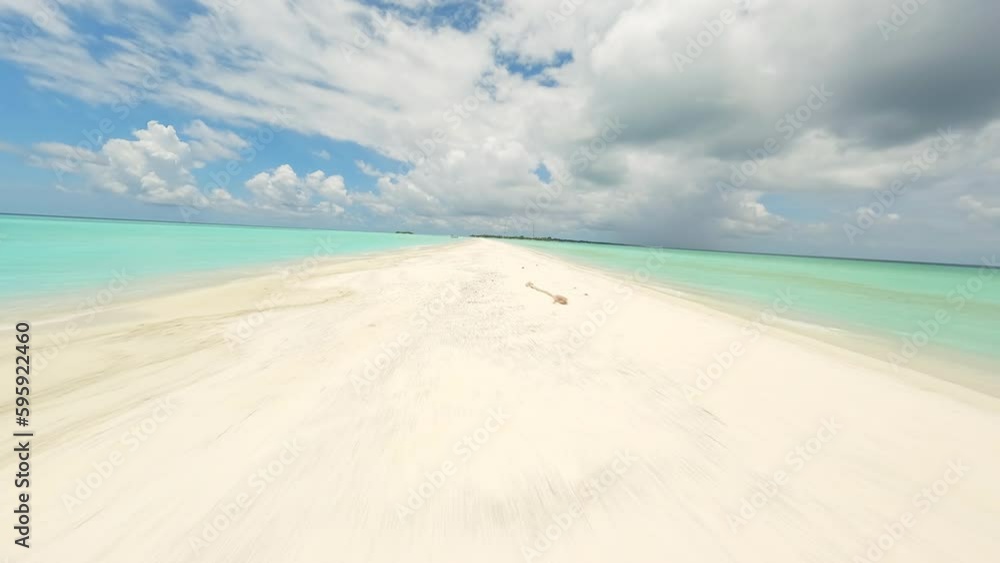 Flying over a sandy beach in the Maldives Flying over a sandy beach in the Maldives