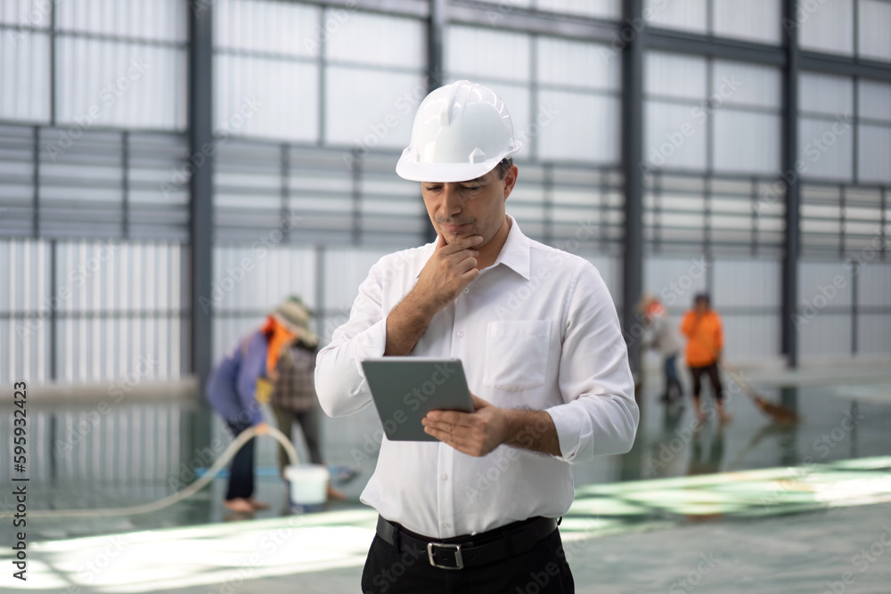 Worker with empty warehouse or storehouse and preparing the area for placement. Worker with empty warehouse or storehouse and preparing the area for placement.