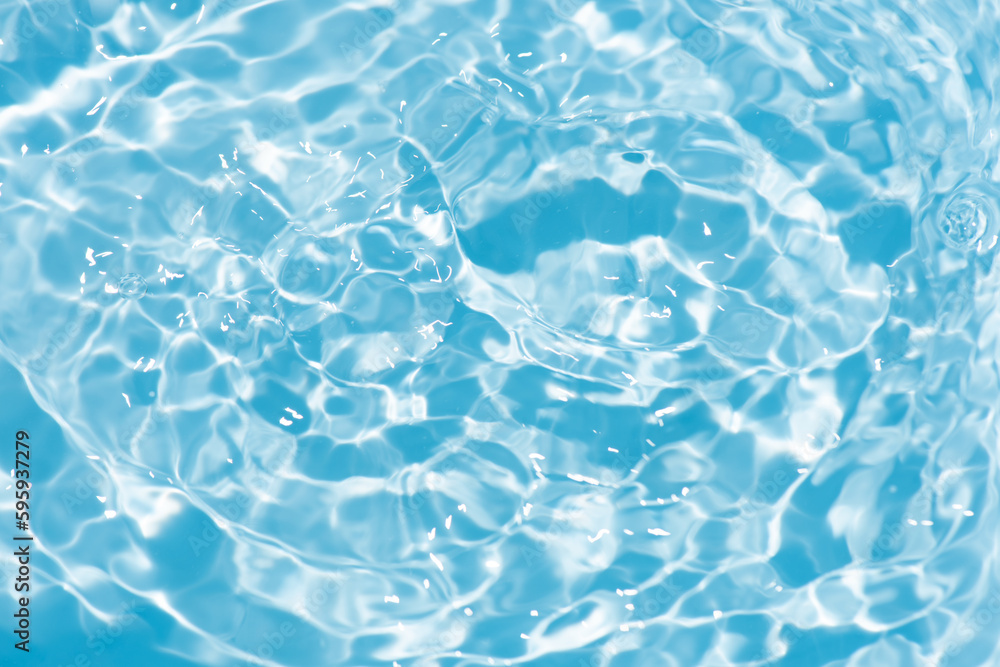  Blue water with ripples on the surface. Defocus blurred transparent blue colored clear calm water surface texture with splashes and bubbles. Water waves with shining pattern texture background textur