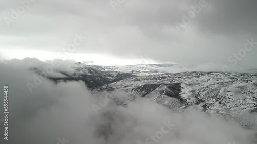 Wallpaper Mural Aerial push in above low clouds in snowy mountain landscape in Gunnison Colorado on stormy winter day Torontodigital.ca