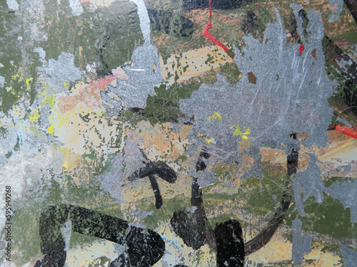 Graffiti spray marker ink and wheat pasting texture background wallpaper covered doorway in urban city	
