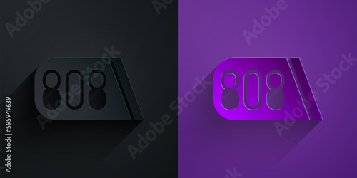 Paper cut Drum machine music producer equipment icon isolated on black on purple background. Paper art style. Vector