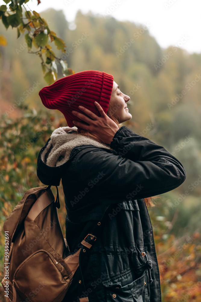 Side view of young woman enjoying a view of nature.Travel,slow life concept. - obrazy, fototapety, plakaty 