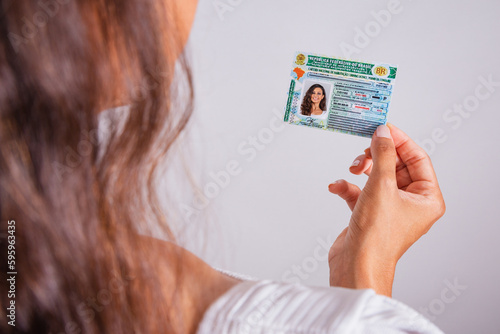 Obraz na płótnie Hand holding driver's license, Brazilian document.