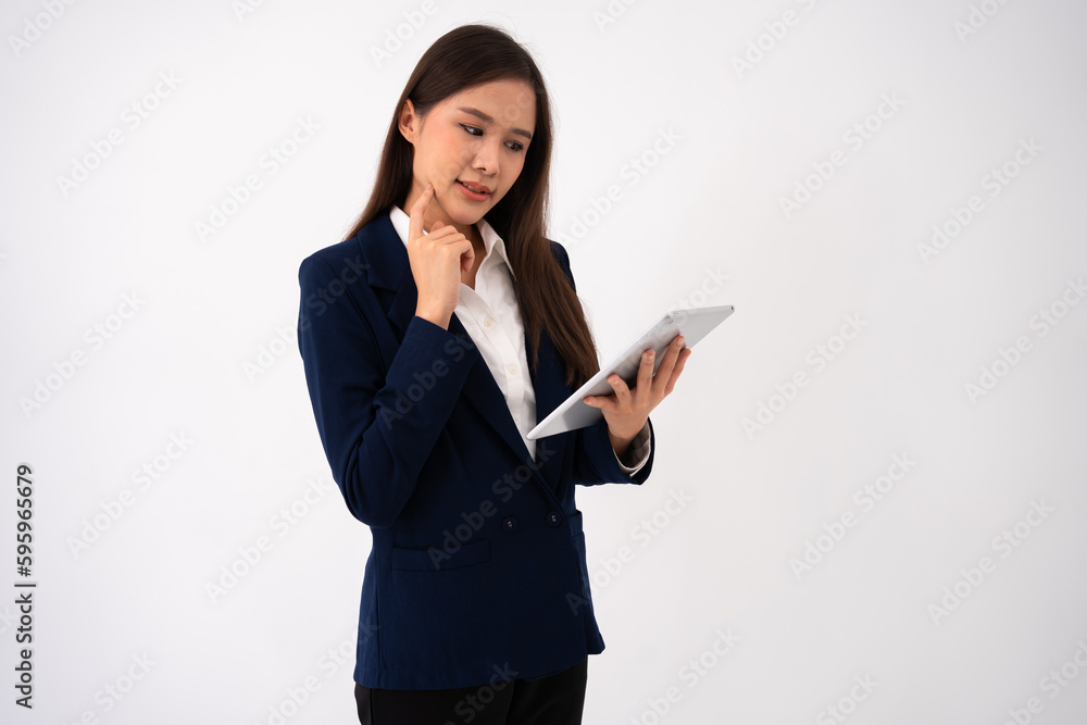 Portrait of happy young thoughtful Asian women think for new ideas and holding tablet on isolated white background. Concept of advertising marketing and product placement. Portrait of happy young thoughtful Asian women think for new ideas and holding tablet on isolated white background. Concept of advertising marketing and product placement.